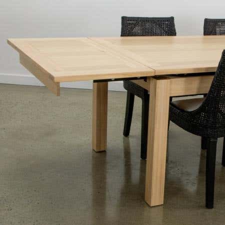 Extended Midland Dining Table showcasing seamless extension mechanism.